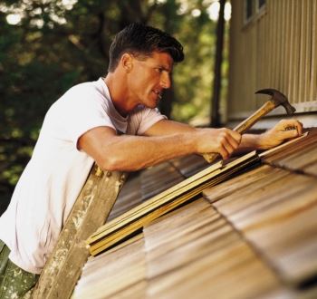 Repairing a shake shingle roof; image courtesy Jayla Barnsen